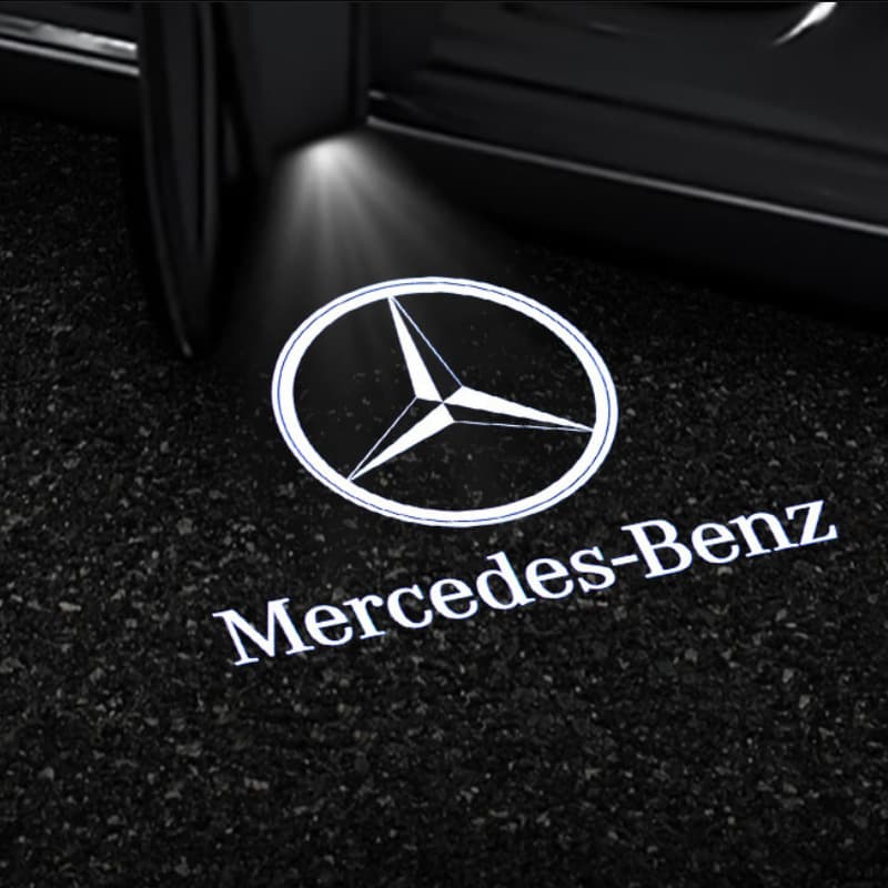Mercedes-Benz logo projected onto a carpeted floor